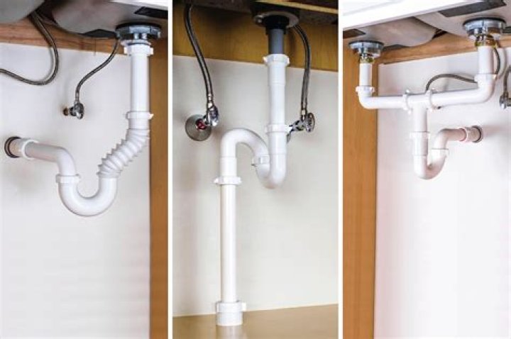 How should a double sink with garbage disposal be plumbed?